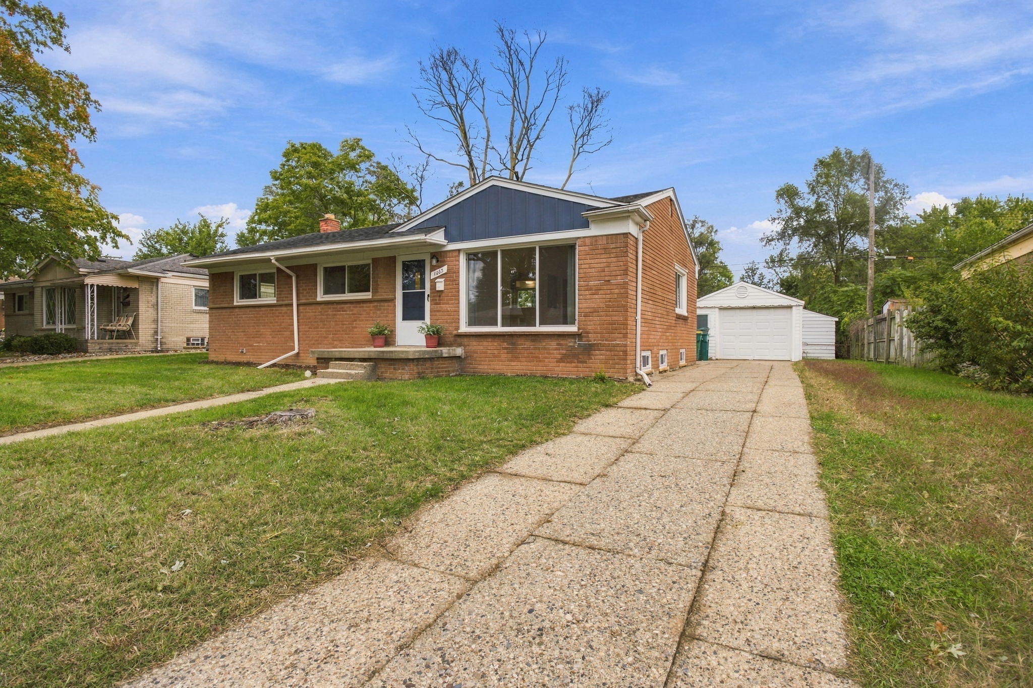 The brick home and detached garage at 1063 Lori Street in Ypsilanti Township